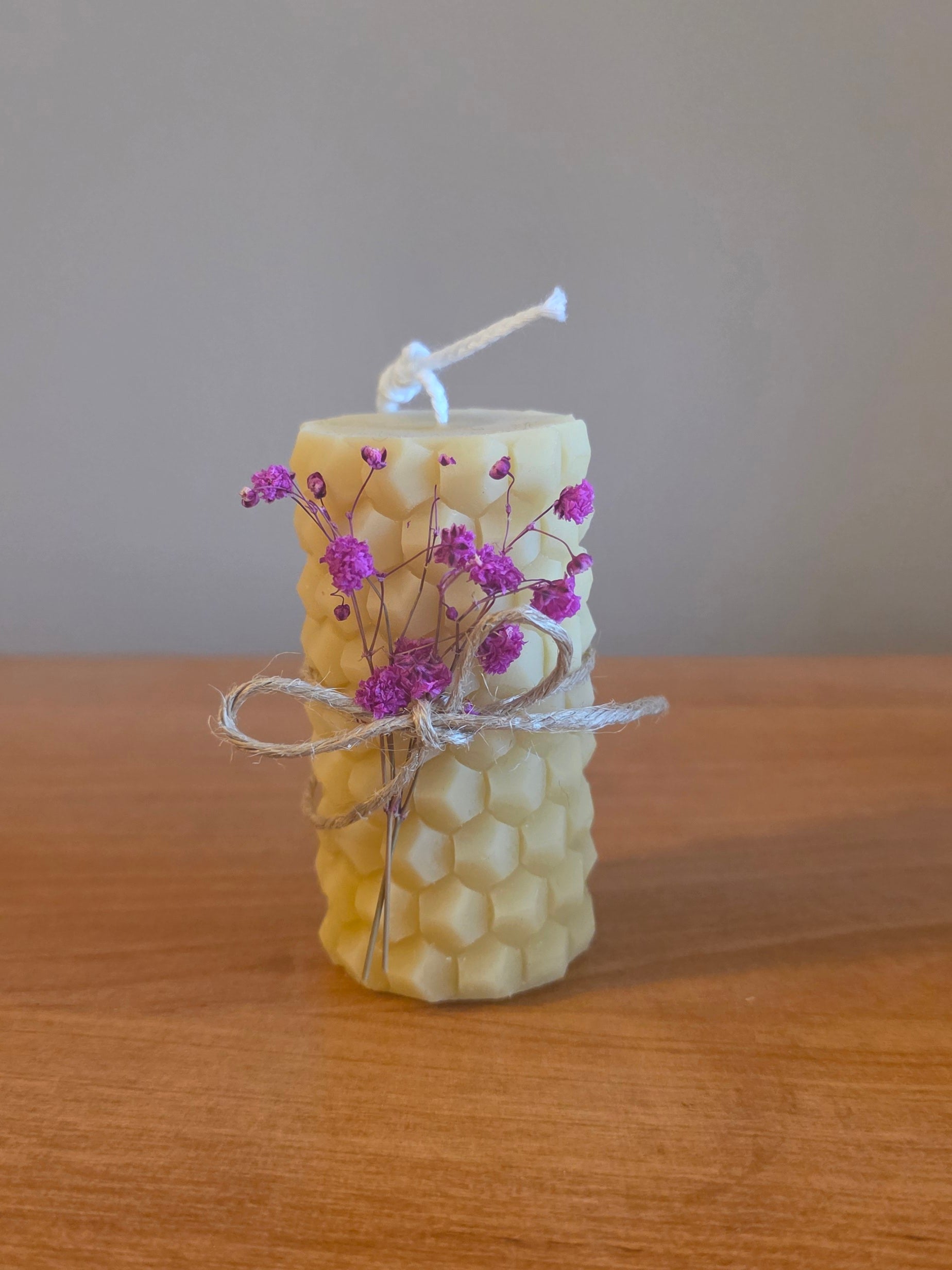 Beeswax pillar candle with pink flowers